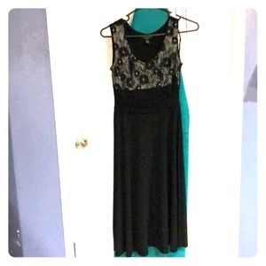 Medium Length black dress  with  a flower lace top